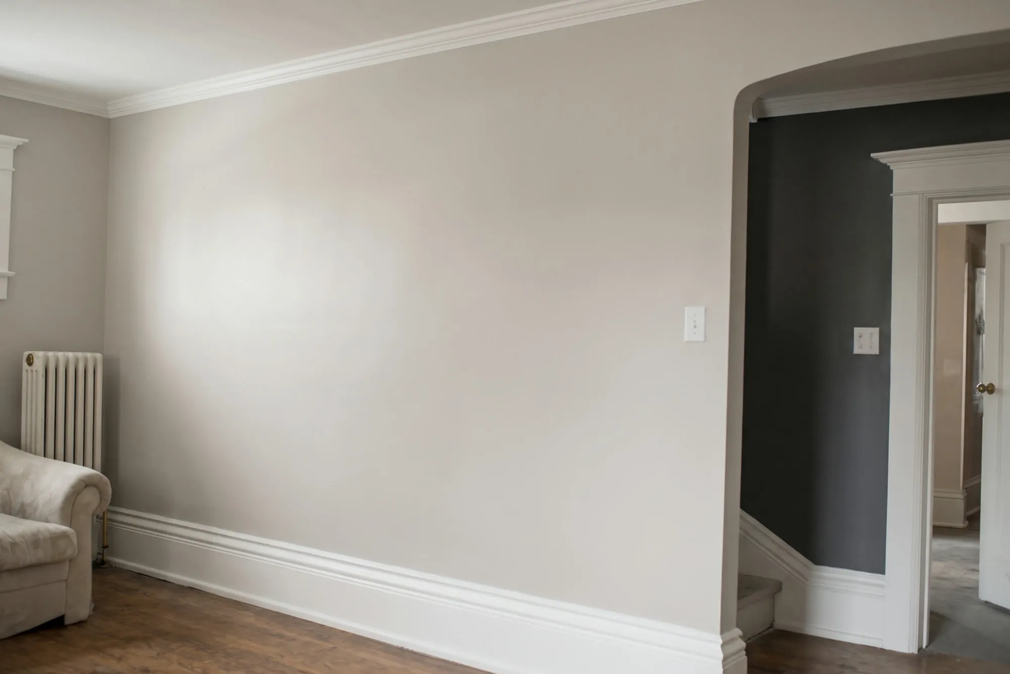 Repainted living room with greige walls and white trim