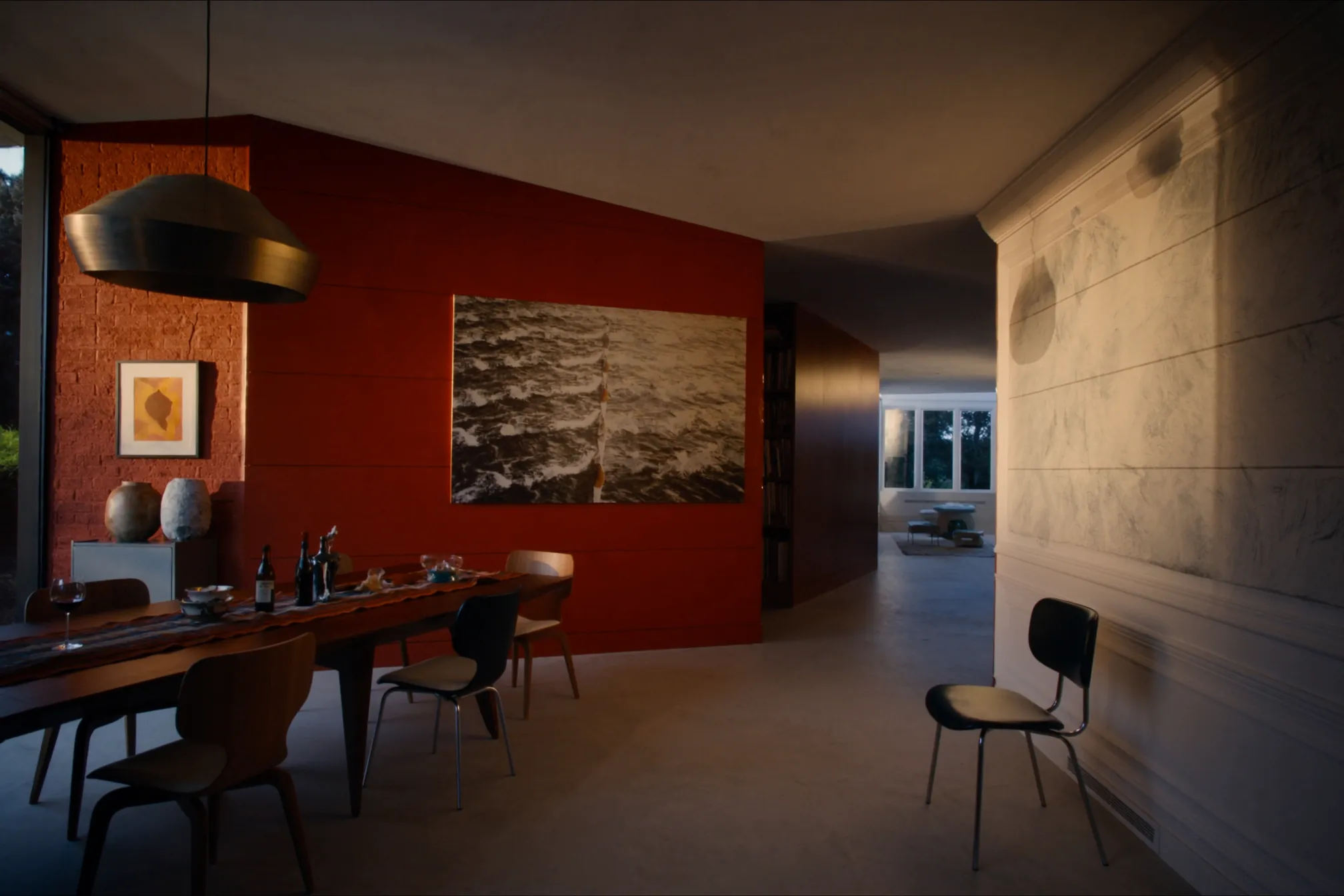 Dining room with a terracotta feature wall