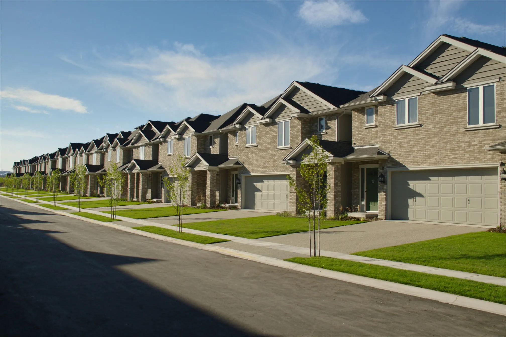 New brick townhomes on a finished street